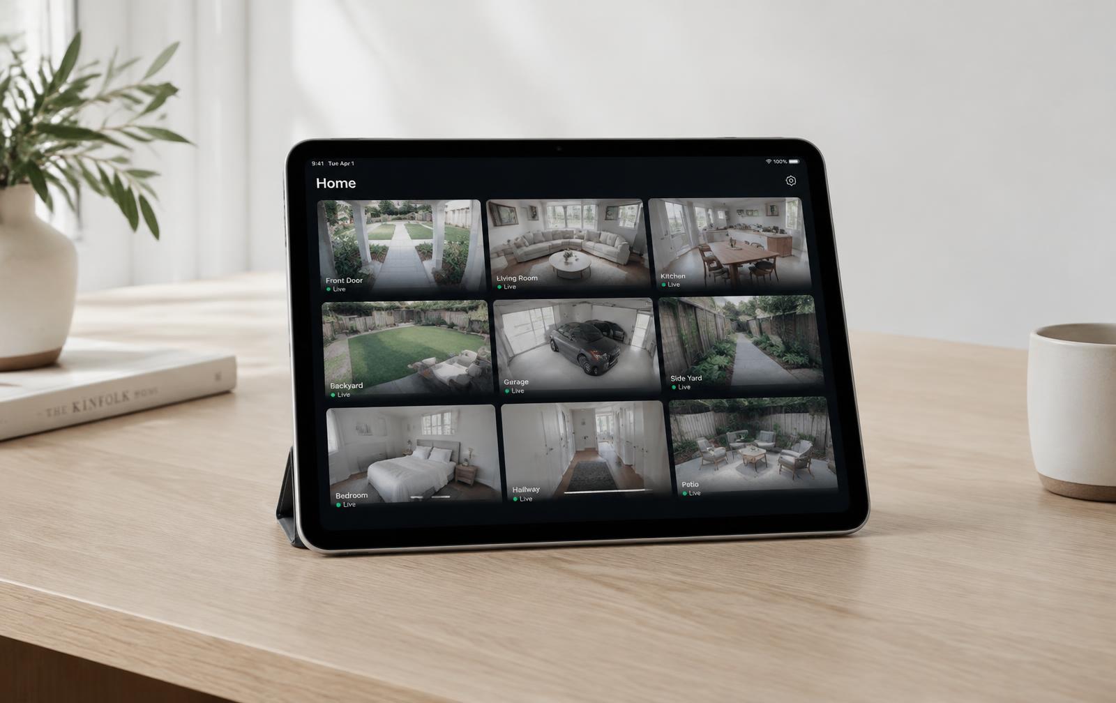 iPad on a desk showing nine live camera feeds in the Smart Systems app